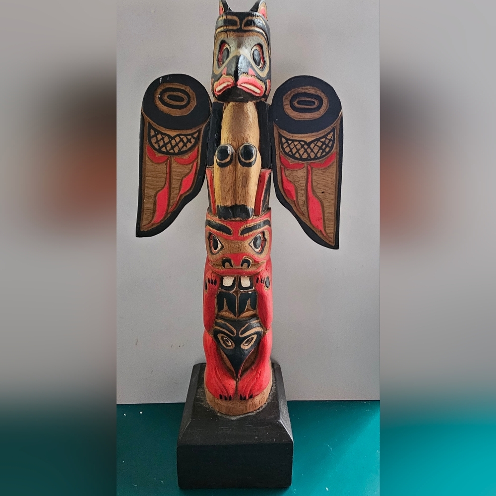 Authentic Handcrafted Totem Pole with Red and Brown Accents from Alaska